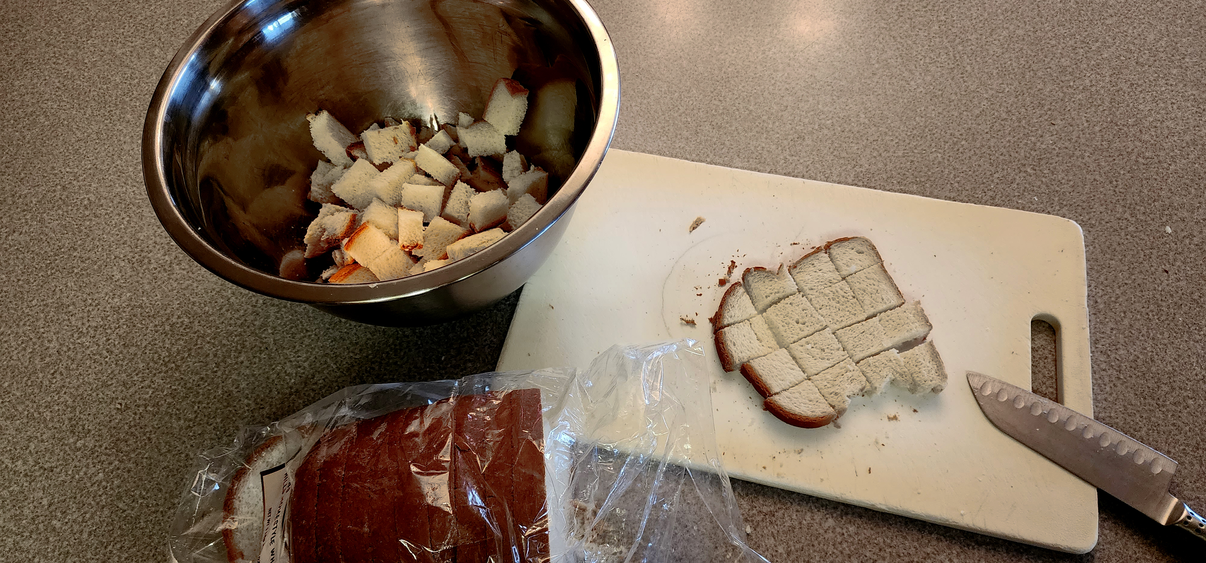 Diced bread in a mixing bowl